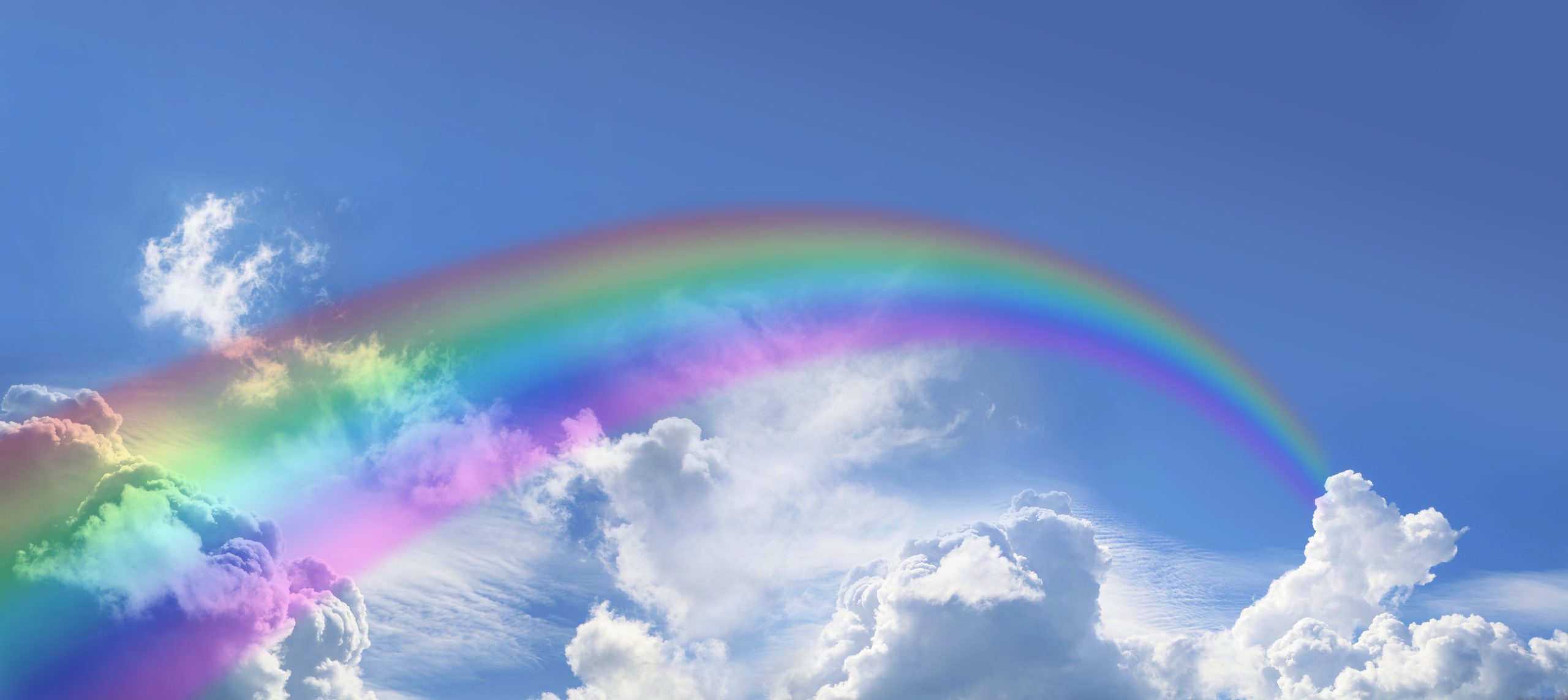 Rainbow across a cloudy sky